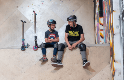 Two-boys-scootering-610x393